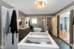 Full bathroom with a soaking tub and vanity - 