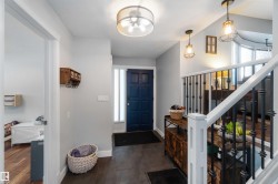 Foyer entrance featuring baseboards - 