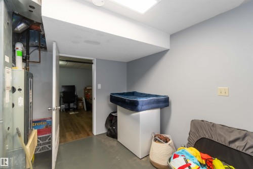 Finished basement featuring heating unit and an office area - 6 Garraway Pl, St. Albert, AB - Indoor Photo Showing Other Room