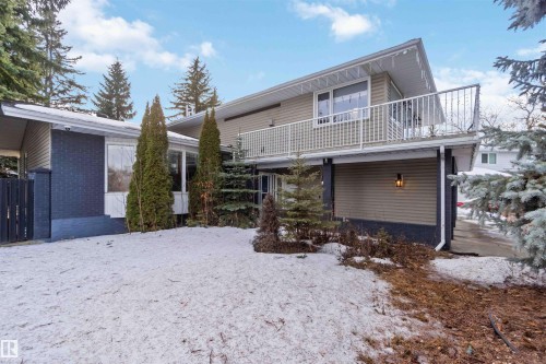 Snow covered house featuring brick siding and a balcony - 6 Garraway Pl, St. Albert, AB - Outdoor