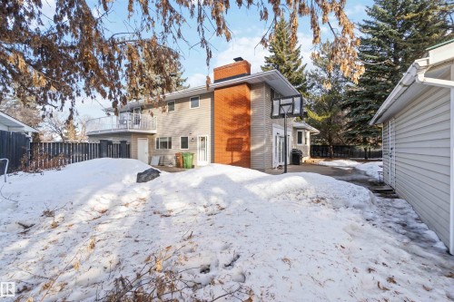 Snow covered property with a chimney - 6 Garraway Pl, St. Albert, AB - Outdoor