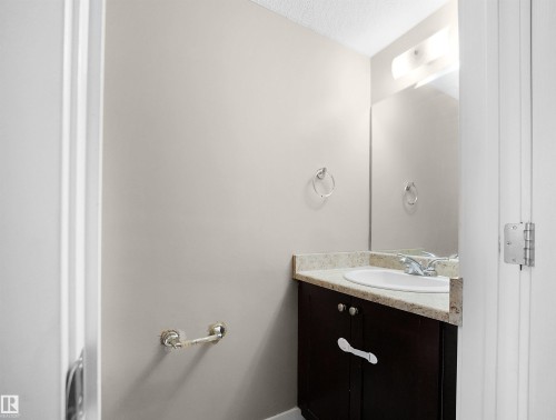 Bathroom with vanity and a textured ceiling - 791 Abbottsfield Road, Edmonton, AB - Indoor Photo Showing Bathroom