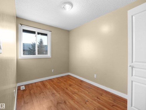 Unfurnished room with a textured ceiling and wood finished floors - 791 Abbottsfield Road, Edmonton, AB - Indoor Photo Showing Other Room
