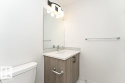 Bathroom featuring toilet and vanity - 
