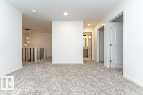 Empty room featuring light carpet and recessed lighting - 3972 Wren Loop, Edmonton, AB - Indoor Photo Showing Other Room