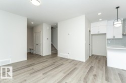 Unfurnished living room featuring light wood-type flooring and recessed lighting - 