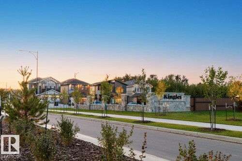 View of asphalt street with sidewalks, a residential view, curbs, and street lights - 3972 Wren Loop, Edmonton, AB - Outdoor