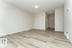 Unfurnished room with light wood finished floors and recessed lighting - 