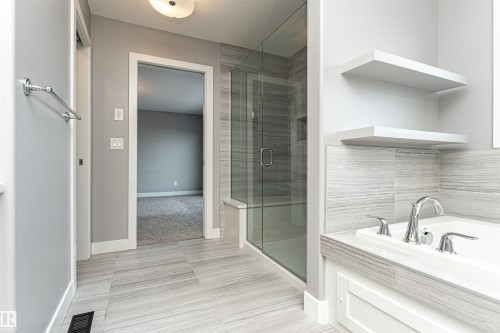 Full bathroom with a garden tub and a shower stall - 3611 Keswick Boulevard, Edmonton, AB - Indoor Photo Showing Bathroom