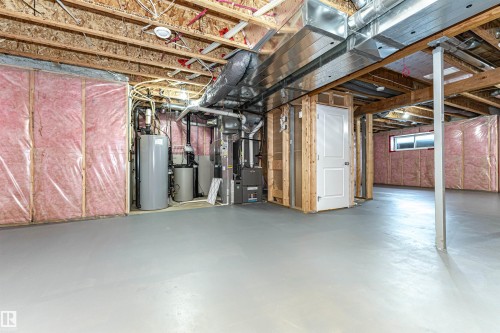 Basement with water heater and a water softener - 3611 Keswick Boulevard, Edmonton, AB - Indoor Photo Showing Basement