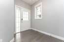 Doorway with wood finished floors - 3611 Keswick Boulevard, Edmonton, AB  - Indoor Photo Showing Other Room 