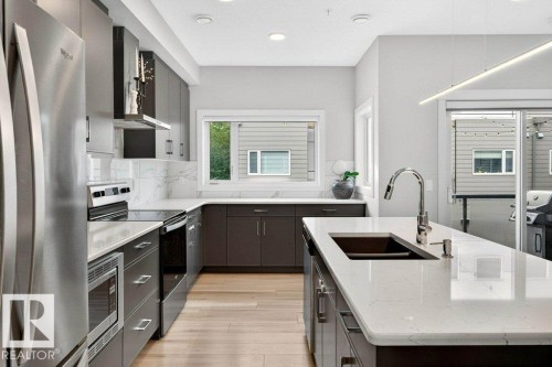 7 9745 92 Street, Edmonton, AB - Indoor Photo Showing Kitchen With Double Sink With Upgraded Kitchen