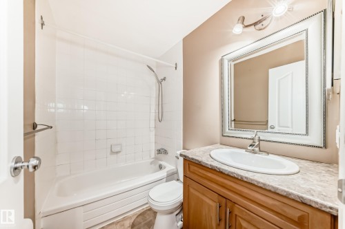 Full bath with vanity and bathtub / shower combination - 5308 20 Avenue, Edmonton, AB - Indoor Photo Showing Bathroom