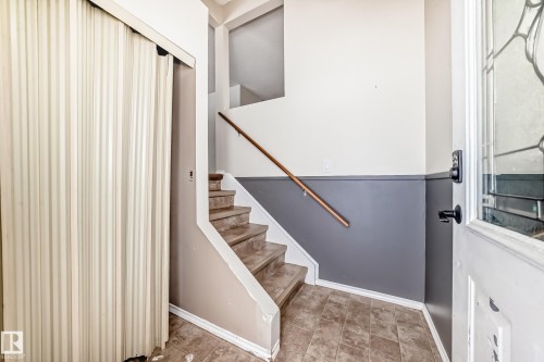Stairway with baseboards - 5308 20 Avenue, Edmonton, AB - Indoor Photo Showing Other Room