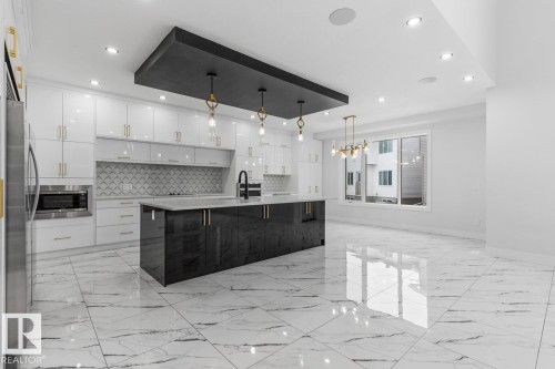 5804 Soleil Boulevard, Beaumont, AB - Indoor Photo Showing Kitchen With Upgraded Kitchen