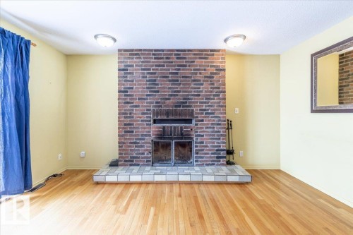 125 Pine Drive, Wetaskiwin, AB - Indoor Photo Showing Living Room With Fireplace