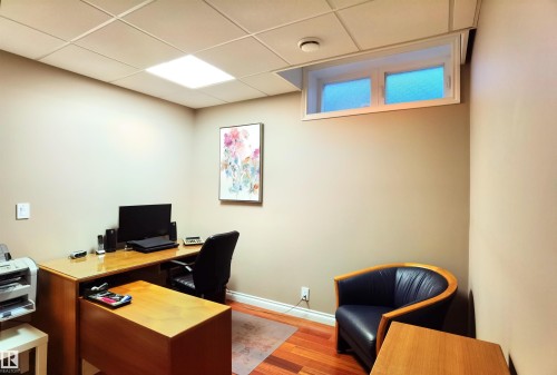 Office space with light wood-style flooring and a paneled ceiling - 169 Callaghan Drive, Edmonton, AB - Indoor Photo Showing Office