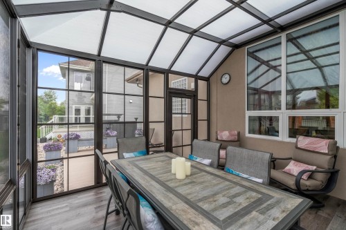 Sunroom / solarium featuring outdoor dining space and vaulted ceiling - 169 Callaghan Drive, Edmonton, AB - Indoor Photo Showing Other Room
