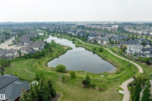Aerial view of property and surrounding area with a large body of water and nearby suburban area - 169 Callaghan Drive, Edmonton, AB - Outdoor With View
