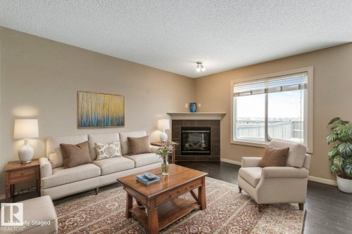 130 Keystone Crescent, Leduc, AB - Indoor Photo Showing Living Room With Fireplace