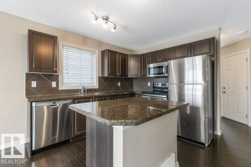 130 Keystone Crescent, Leduc, AB - Indoor Photo Showing Kitchen With Stainless Steel Kitchen With Upgraded Kitchen