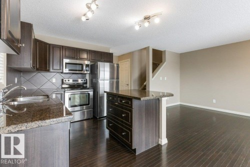 130 Keystone Crescent, Leduc, AB - Indoor Photo Showing Kitchen With Stainless Steel Kitchen With Double Sink
