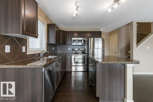 130 Keystone Crescent, Leduc, AB - Indoor Photo Showing Kitchen With Stainless Steel Kitchen With Double Sink