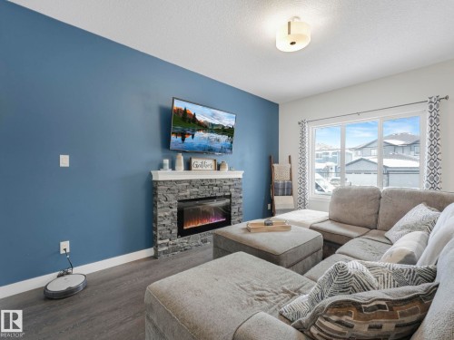 725 Berg Loop, Leduc, AB - Indoor Photo Showing Living Room With Fireplace