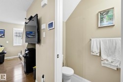 Bathroom with a textured ceiling and hardwood / wood-style flooring - 