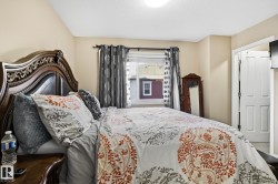 Bedroom featuring a textured ceiling - 