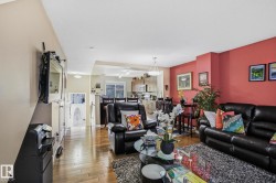 Living room with hardwood / wood-style floors - 