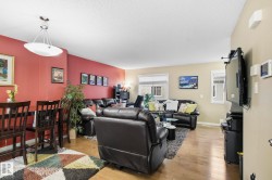 Living area featuring a textured ceiling and light wood finished floors - 
