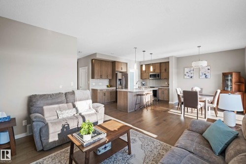 Living room with dark wood finished floors and baseboards - 3904 5 Street, Edmonton, AB - Indoor Photo Showing Living Room