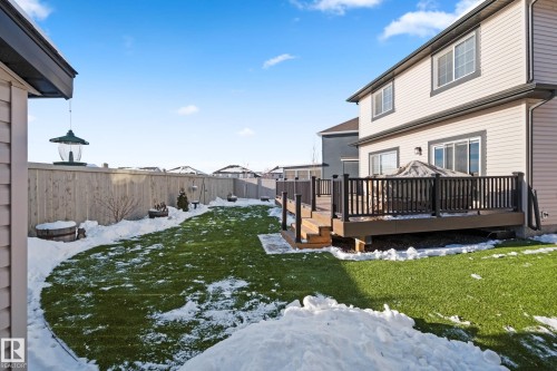 Snowy yard with a deck and a fenced backyard - 3904 5 Street, Edmonton, AB - Outdoor With Deck Patio Veranda