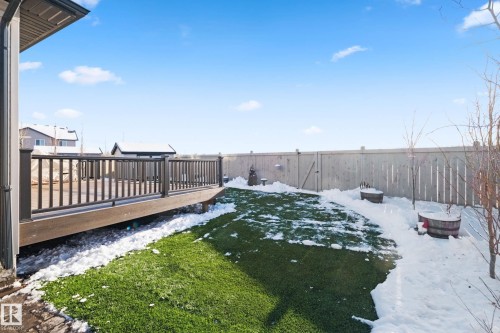 Yard layered in snow featuring a deck and a fenced backyard - 3904 5 Street, Edmonton, AB - Outdoor