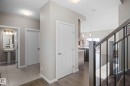 Hallway with a textured ceiling and dark wood-type flooring - 3904 5 Street, Edmonton, AB  - Indoor Photo Showing Other Room 