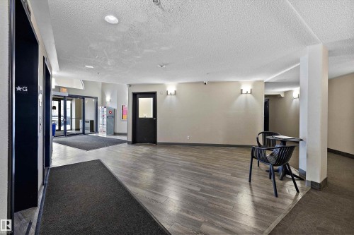 Community lobby with a textured ceiling - 2407 320 Clareview Station Drive, Edmonton, AB - Indoor Photo Showing Other Room