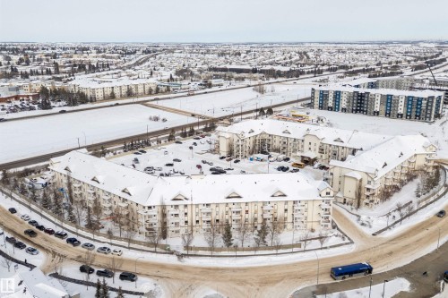 Snowy aerial view with a view of apartment building / complex - 2407 320 Clareview Station Drive, Edmonton, AB - Outdoor With View