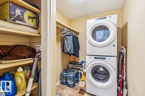 Laundry with built in shelves - 38 3003 34 Avenue, Edmonton, AB - Indoor Photo Showing Laundry Room