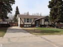 Tudor-style exterior with a brown shingle roof and contrasting dark trim - 5220 - 56 Street, Barrhead, AB  - Outdoor With Facade 