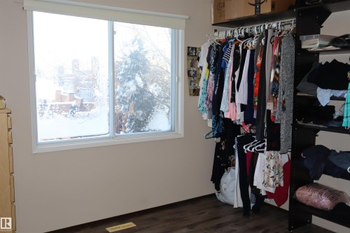 Walk in closet with dark wood finished floors - 5220 - 56 Street, Barrhead, AB - Indoor