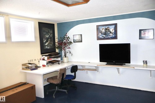 Office featuring a textured ceiling and crown molding - 5220 - 56 Street, Barrhead, AB - Indoor Photo Showing Office