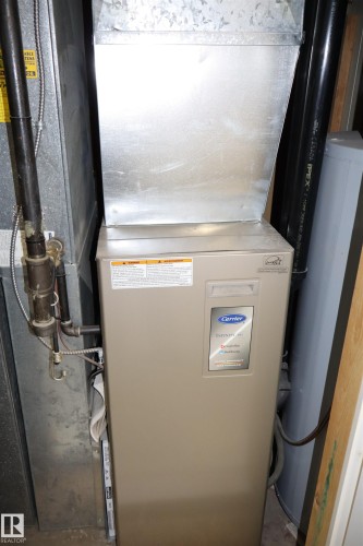 Utility room featuring heating unit - 5220 - 56 Street, Barrhead, AB - Indoor Photo Showing Basement