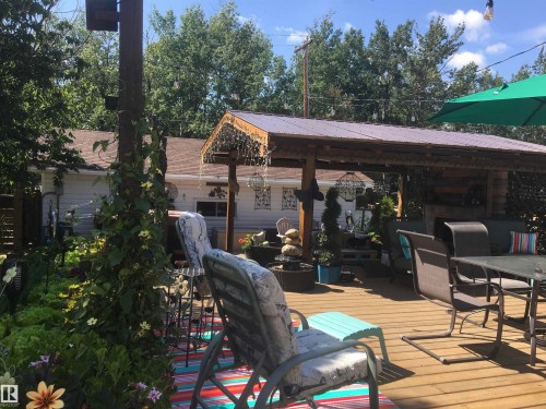 Deck with outdoor dining area - 5220 - 56 Street, Barrhead, AB - Outdoor