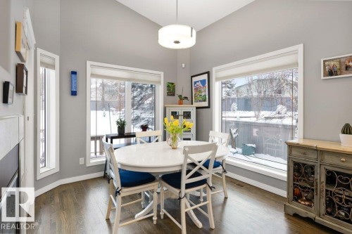 Dining room with dark wood-style flooring and baseboards - 8 Osborne Close, St. Albert, AB - Indoor Photo Showing Dining Room