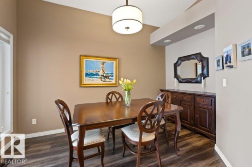 Dining area with baseboards and dark wood-style floors - 8 Osborne Close, St. Albert, AB - Indoor Photo Showing Dining Room