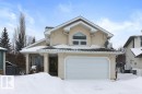 View of front of home with stucco siding and a garage - 8 Osborne Close, St. Albert, AB  - Outdoor 