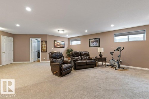 Carpeted living room featuring baseboards and recessed lighting - 8 Osborne Close, St. Albert, AB - Indoor Photo Showing Basement
