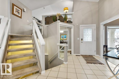 Entrance foyer featuring light tile patterned flooring and lofted ceiling - 8 Osborne Close, St. Albert, AB - Indoor Photo Showing Other Room