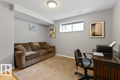 Carpeted office featuring a textured ceiling and baseboards - 8 Osborne Close, St. Albert, AB - Indoor Photo Showing Office